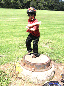 zach dancing on manhole cover